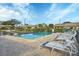 Community swimming pool with lounge chairs at 2709 60Th Avenue N Plz # D, Bradenton, FL 34207