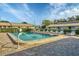 Community pool with multiple lounge chairs at 2709 60Th Avenue N Plz # D, Bradenton, FL 34207