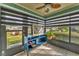 Sunroom with window seating, storage, and a ceiling fan at 2709 60Th Avenue N Plz # D, Bradenton, FL 34207