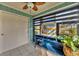 Bright sunroom features tiled flooring, window seating, and a storage closet at 2709 60Th Avenue N Plz # D, Bradenton, FL 34207