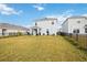 Large backyard with patio and a view of neighboring houses at 3408 Hilltop Cir, Bradenton, FL 34211
