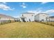 Spacious backyard with patio and a view of neighboring houses at 3408 Hilltop Cir, Bradenton, FL 34211
