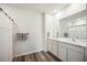 Double vanity bathroom with modern finishes at 3408 Hilltop Cir, Bradenton, FL 34211