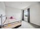 Spacious bedroom with a bed and a large window with a scenic view at 3408 Hilltop Cir, Bradenton, FL 34211