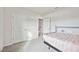 Well-lit bedroom with a bed and access to another room at 3408 Hilltop Cir, Bradenton, FL 34211
