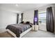 Bright bedroom with king-size bed and two windows at 3408 Hilltop Cir, Bradenton, FL 34211