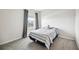 Cozy bedroom featuring a bed and a window overlooking the neighborhood at 3408 Hilltop Cir, Bradenton, FL 34211