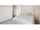 Bright bedroom with carpeted floors and a modern headboard at 3408 Hilltop Cir, Bradenton, FL 34211