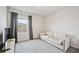 Bright bedroom with a comfortable sofa and a window offering natural light at 3408 Hilltop Cir, Bradenton, FL 34211