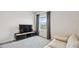 Spacious bonus room with TV and comfortable seating at 3408 Hilltop Cir, Bradenton, FL 34211