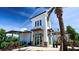 Modern clubhouse with palm trees and landscaping at 3408 Hilltop Cir, Bradenton, FL 34211