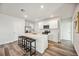 Modern kitchen with white cabinets, quartz countertops, and stainless steel appliances at 3408 Hilltop Cir, Bradenton, FL 34211