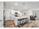 Modern kitchen with white cabinets, quartz countertops and island at 3408 Hilltop Cir, Bradenton, FL 34211