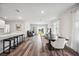 Open concept kitchen and dining area with an island and modern appliances at 3408 Hilltop Cir, Bradenton, FL 34211
