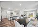Open concept kitchen and dining area with an island and modern appliances at 3408 Hilltop Cir, Bradenton, FL 34211