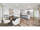 Modern kitchen with white cabinets and a large dining table at 3408 Hilltop Cir, Bradenton, FL 34211