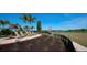 Landscaped area with seating and lake views at 3408 Hilltop Cir, Bradenton, FL 34211