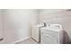 Laundry room with washer, dryer, and overhead shelving at 3408 Hilltop Cir, Bradenton, FL 34211