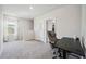 Spacious loft area with carpeted floor and a desk at 3408 Hilltop Cir, Bradenton, FL 34211
