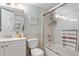 Clean bathroom with a shower/tub combo, white vanity, and a mirrored medicine cabinet at 3421 Clark Rd # 122, Sarasota, FL 34231