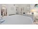 Bedroom with a queen bed, dresser, and view into the bathroom at 3421 Clark Rd # 122, Sarasota, FL 34231