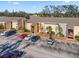 Exterior view of apartment building with parking at 3421 Clark Rd # 122, Sarasota, FL 34231