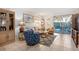 Cozy living room featuring comfortable seating and access to a patio at 3421 Clark Rd # 122, Sarasota, FL 34231