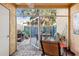 Private patio with seating area, grill, and lush greenery at 3421 Clark Rd # 122, Sarasota, FL 34231