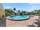 Inviting kidney-shaped pool with lounge chairs at 3421 Clark Rd # 122, Sarasota, FL 34231
