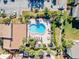 Inviting kidney-shaped pool with lounge chairs and patio furniture at 3421 Clark Rd # 122, Sarasota, FL 34231