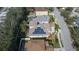 Aerial view showcasing home with solar panels and neighborhood context at 3439 101St E Ave, Parrish, FL 34219