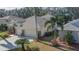 House with 3-car garage and solar panels, surrounded by palm trees at 3439 101St E Ave, Parrish, FL 34219