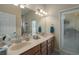 Double vanity bathroom with access to backyard patio at 3439 101St E Ave, Parrish, FL 34219
