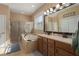 Bathroom with double vanity, garden tub, and walk-in shower at 3439 101St E Ave, Parrish, FL 34219