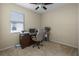 Bright bedroom with home office setup and ceiling fan at 3439 101St E Ave, Parrish, FL 34219