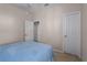 Bedroom with queen bed, closet, and access to another room at 3439 101St E Ave, Parrish, FL 34219