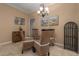 Smaller dining area with a round glass table and wicker chairs at 3439 101St E Ave, Parrish, FL 34219