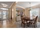 Bright dining area with a wood table and access to the living room at 3439 101St E Ave, Parrish, FL 34219