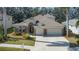 Attractive home exterior, featuring a three-car garage and manicured lawn at 3439 101St E Ave, Parrish, FL 34219