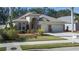 Single-story home with a two-car garage and attractive landscaping at 3439 101St E Ave, Parrish, FL 34219
