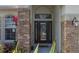 Elegant front door with glass accents and stonework at 3439 101St E Ave, Parrish, FL 34219