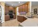 Kitchen boasts ample wood cabinets, stainless steel appliances, and tile floors at 3439 101St E Ave, Parrish, FL 34219
