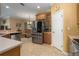 Stainless steel appliances and wood cabinets are featured in this kitchen at 3439 101St E Ave, Parrish, FL 34219