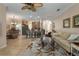 Open living room and kitchen area with a large area rug at 3439 101St E Ave, Parrish, FL 34219
