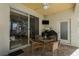 Covered patio with seating area and grill at 3439 101St E Ave, Parrish, FL 34219