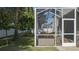 Screened porch with patio furniture and backyard view at 3439 101St E Ave, Parrish, FL 34219
