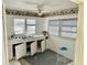 Spacious eat-in kitchen with ample countertop space, bright natural light, and a breakfast nook at 3710 Gulf Of Mexico Dr # D19, Longboat Key, FL 34228