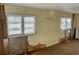 Living room featuring yellow walls, exposed walls and wooden flooring at 3710 Gulf Of Mexico Dr # D19, Longboat Key, FL 34228