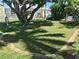 A manicured putting green with a hole provides outdoor recreation and complements lush landscaping at 3710 Gulf Of Mexico Dr # D19, Longboat Key, FL 34228