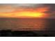 Stunning view of sunset over the ocean and sandy beach at 3710 Gulf Of Mexico Dr # D19, Longboat Key, FL 34228